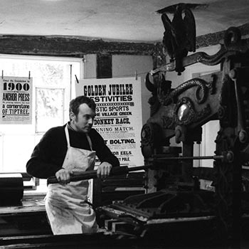 Justin Knopp printing on an early 20th Century Columbian handpress at Wingfield Old College in Suffolk, circa 2003