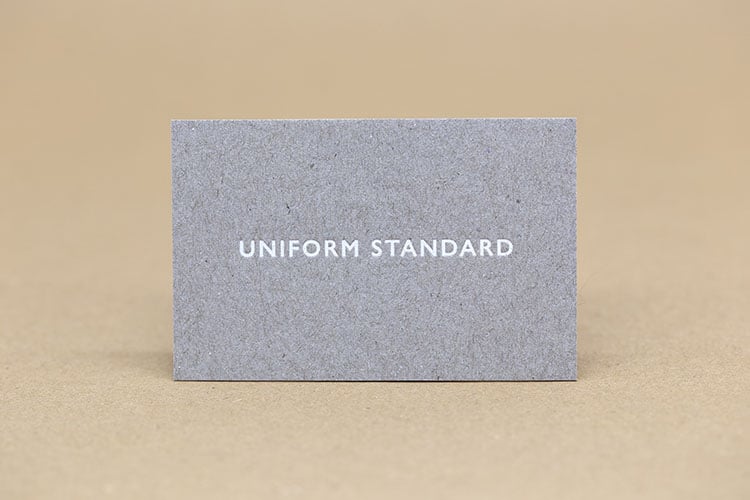 uniform standard business cards white foil stamped recycled greyboard front 750