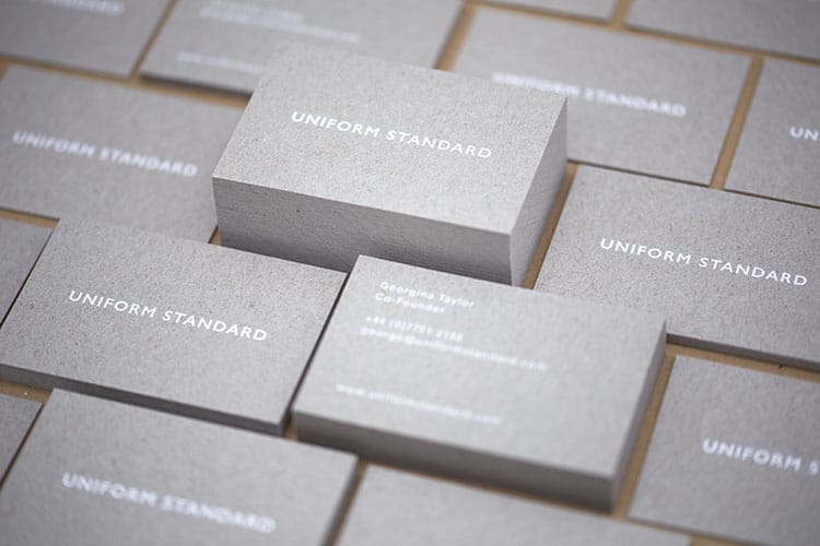 uniform standard business cards white foil stamped recycled greyboard stacks-4 750
